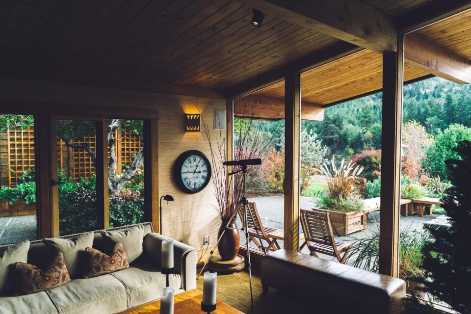 Covered outdoor living room opening onto a landscaped Bay Area backyard